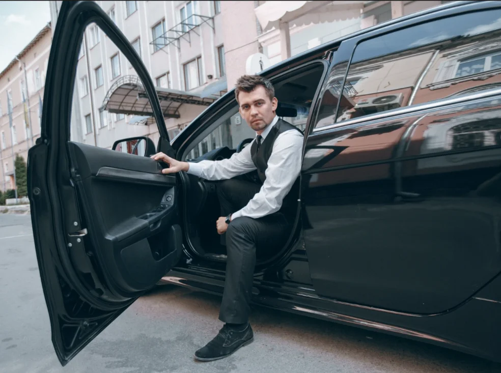 Black sedan — three-quarter view